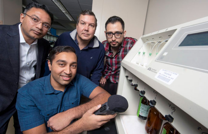 (From left) Mohammad Al Faruque, associate professor of electrical engineering and computer science; Arnav Malawade, a graduate student in Al Faruque’s lab; John Chaput, professor of pharmaceutical sciences; and Sina Faezi, also a graduate student in Al Faruque’s lab.