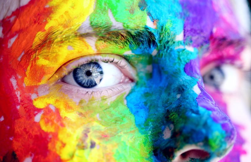 Face with rainbow paint
